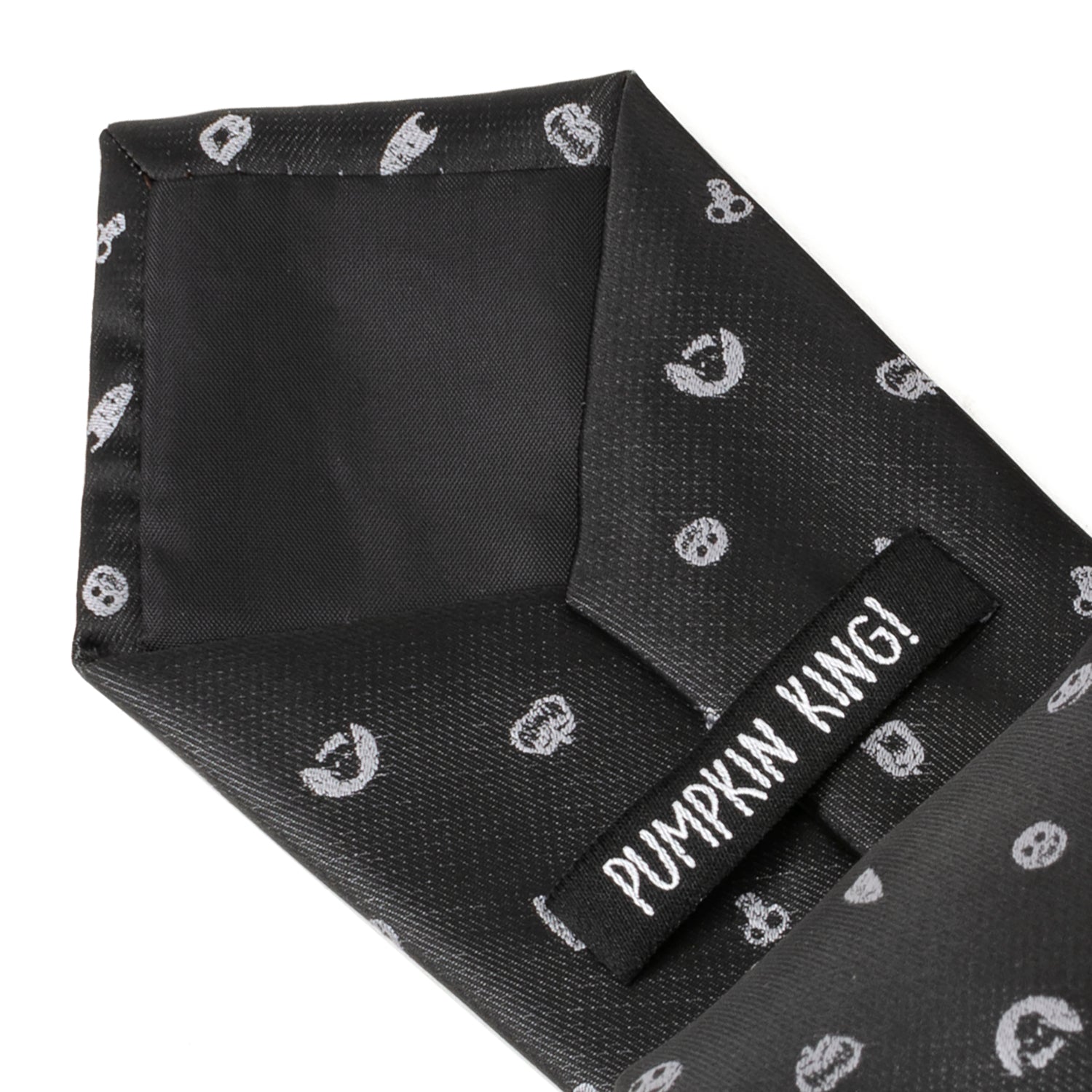 Black tie with white skull patterns and a label reading 'Pumpkin Kwai' on a white background