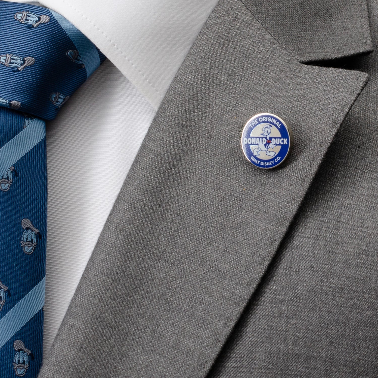 Disney Donald Duck Classic Lapel Pin featuring blue and white enamel design with beveled edge and “The Original Donald Duck” logo, officially licensed by Disney.