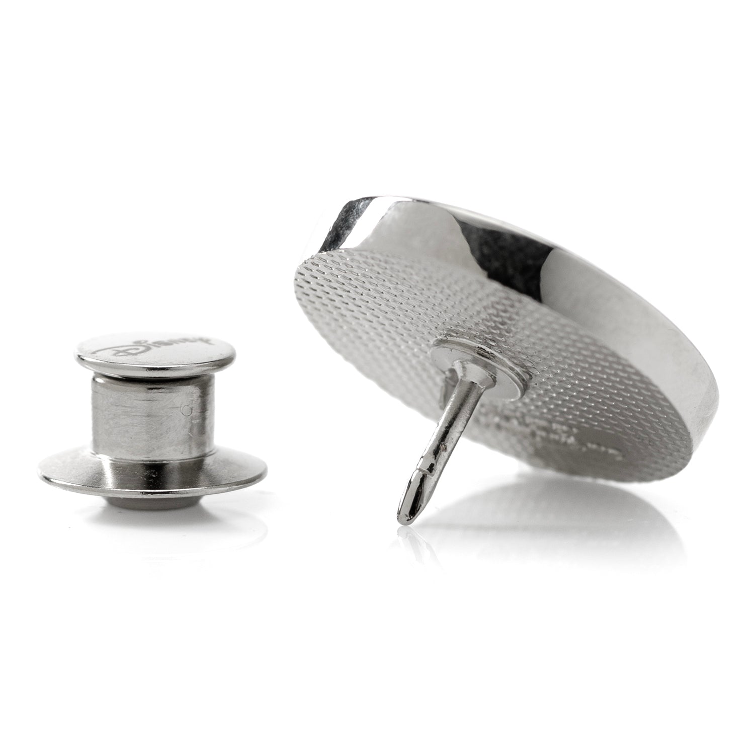 Metallic spool of thread and needle on a white background