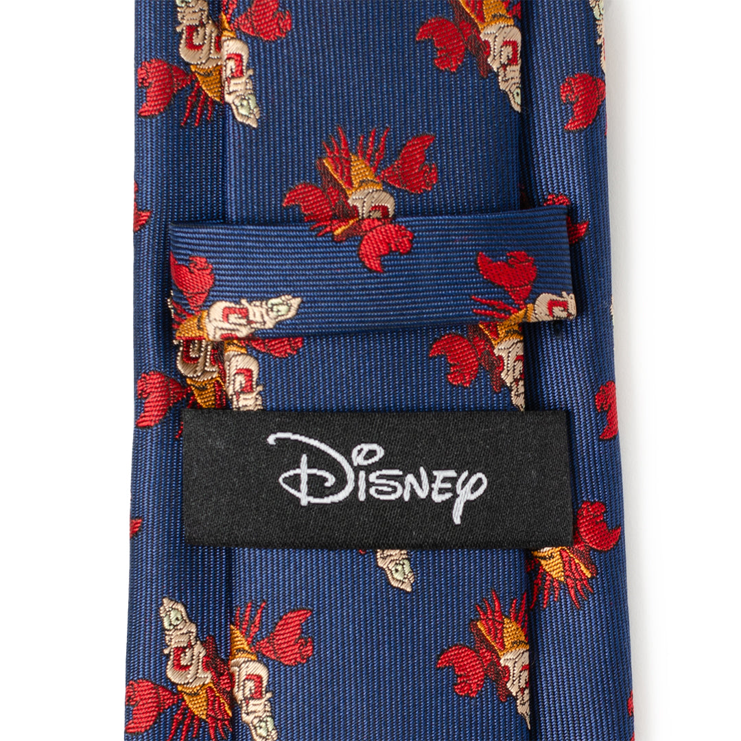 Blue tie with red and gold patterns and Disney logo tag