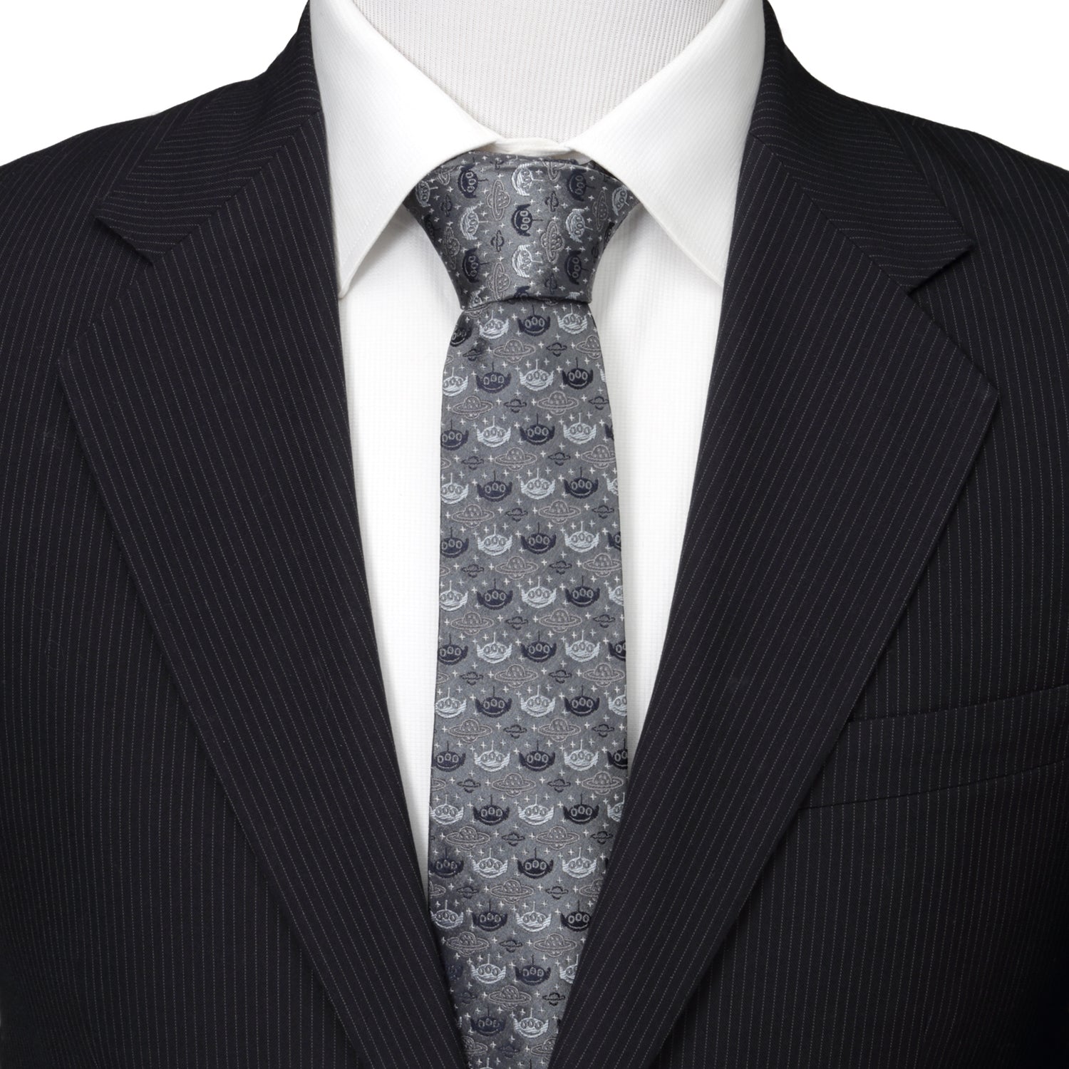 Man wearing a black suit with a patterned gray tie on a white background Toy Story Alien
