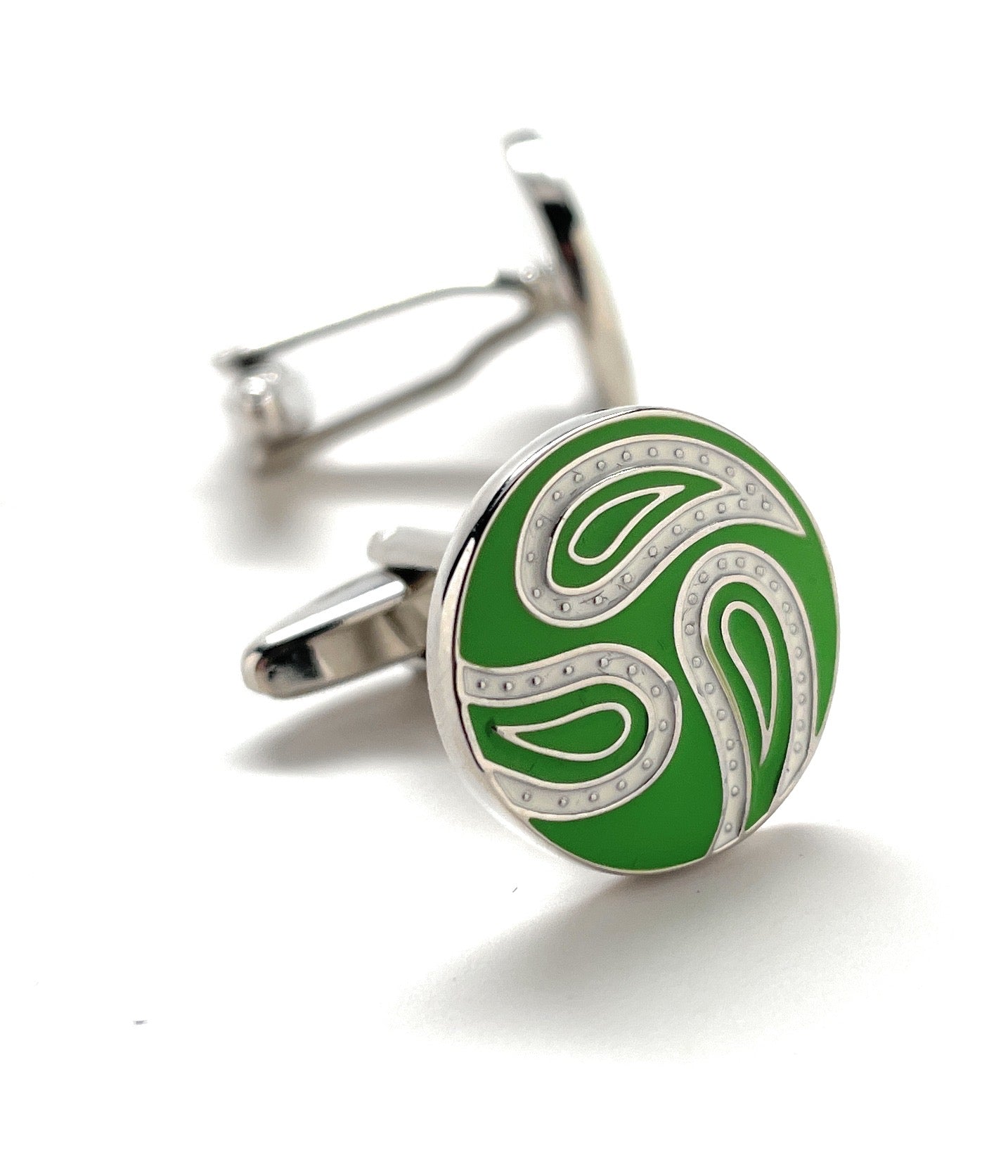 Green cufflinks with silver design on a white background