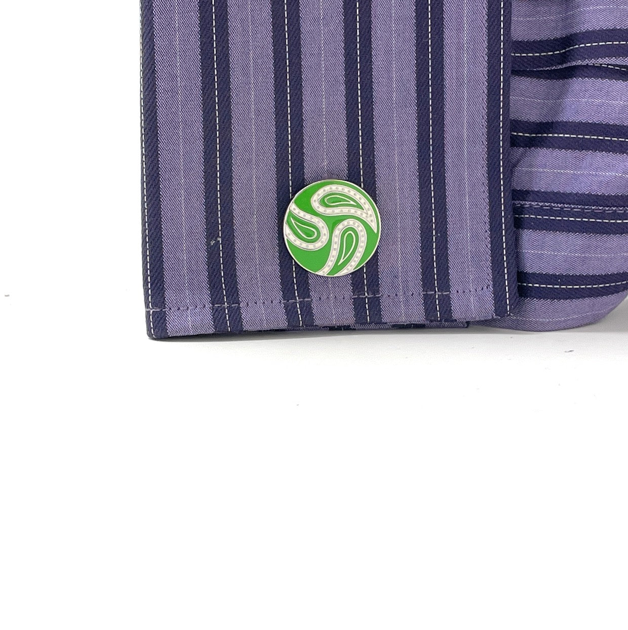 Purple striped fabric with a green and white circular logo on a white background