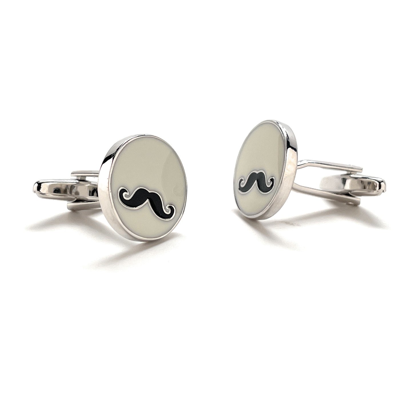 Silver cufflinks with black mustache design on a white background