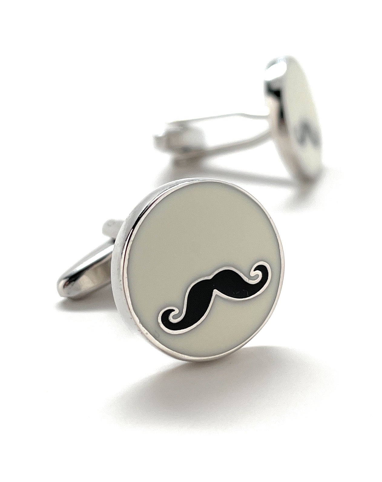 Cufflinks with a mustache design on a white background