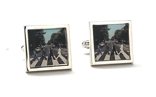 A pair of silver rhodium-plated cufflinks featuring The Beatles on Abbey Road album cover.