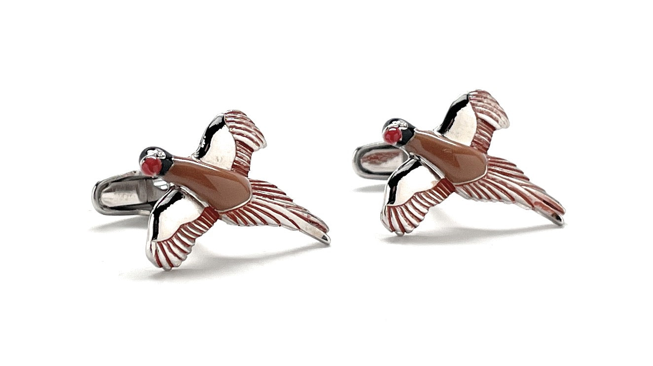 Pair of bird-shaped cufflinks on a white background