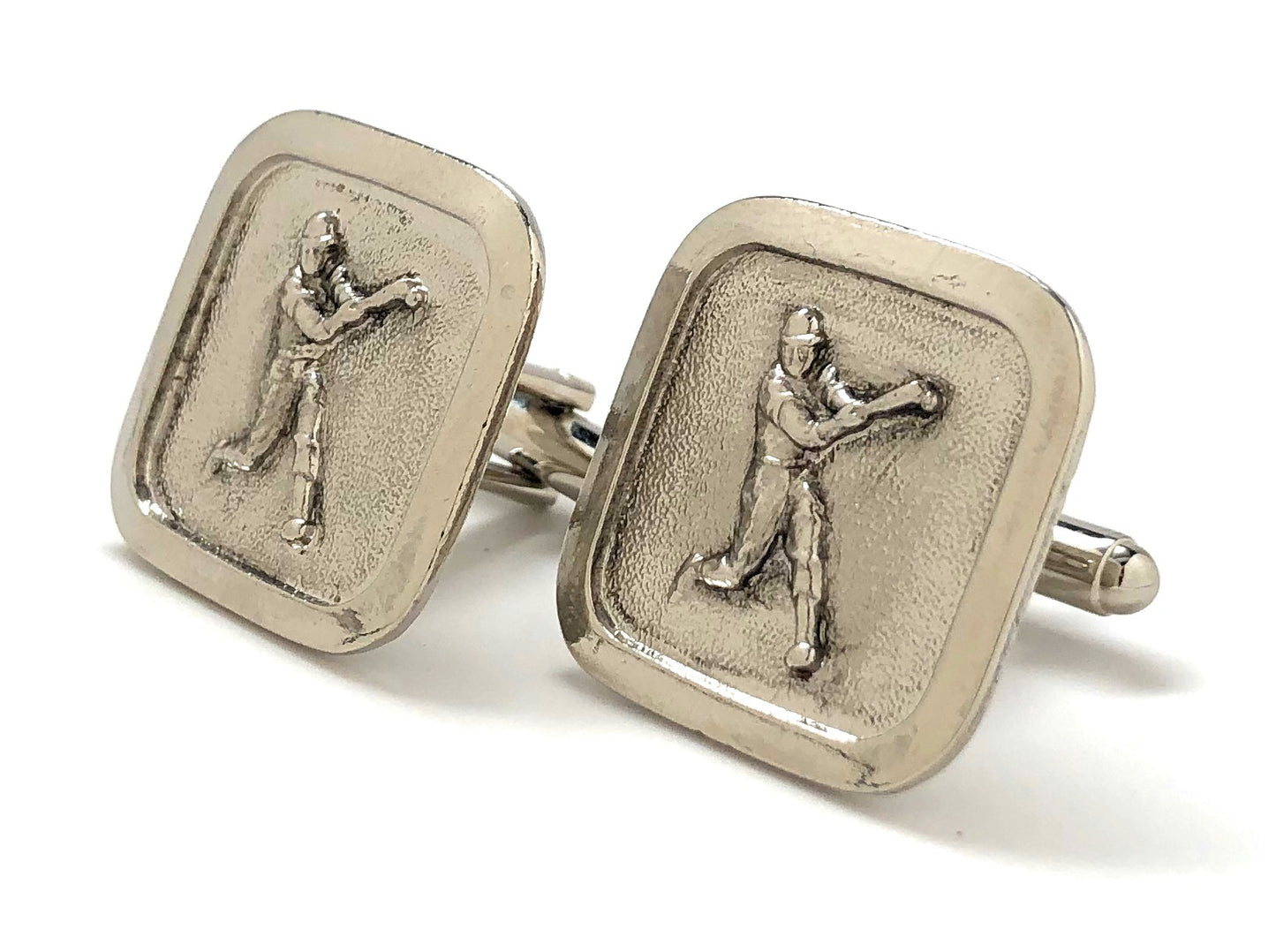Silver cufflinks with golf-themed design on a white background