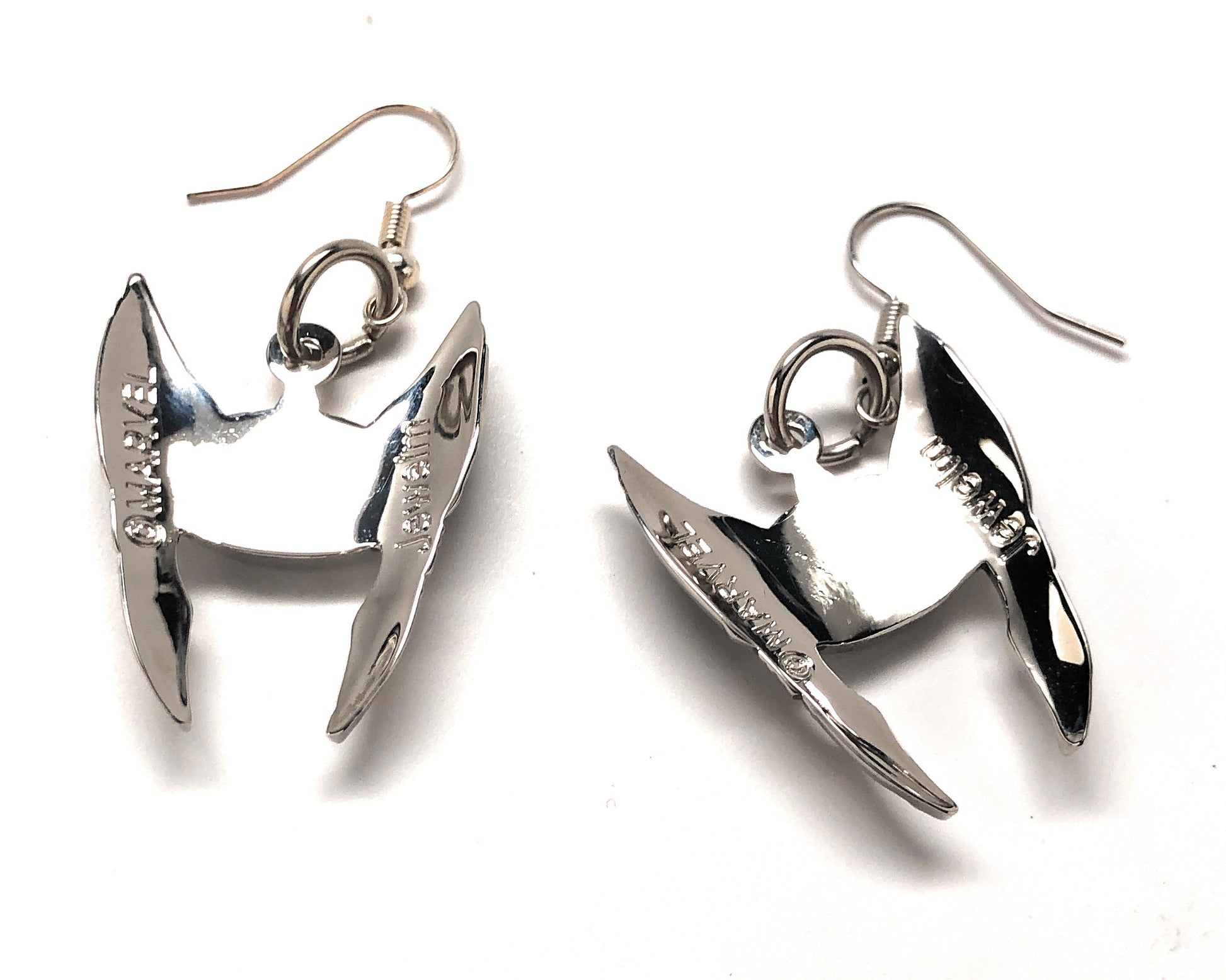 Pair of silver earrings on a white background