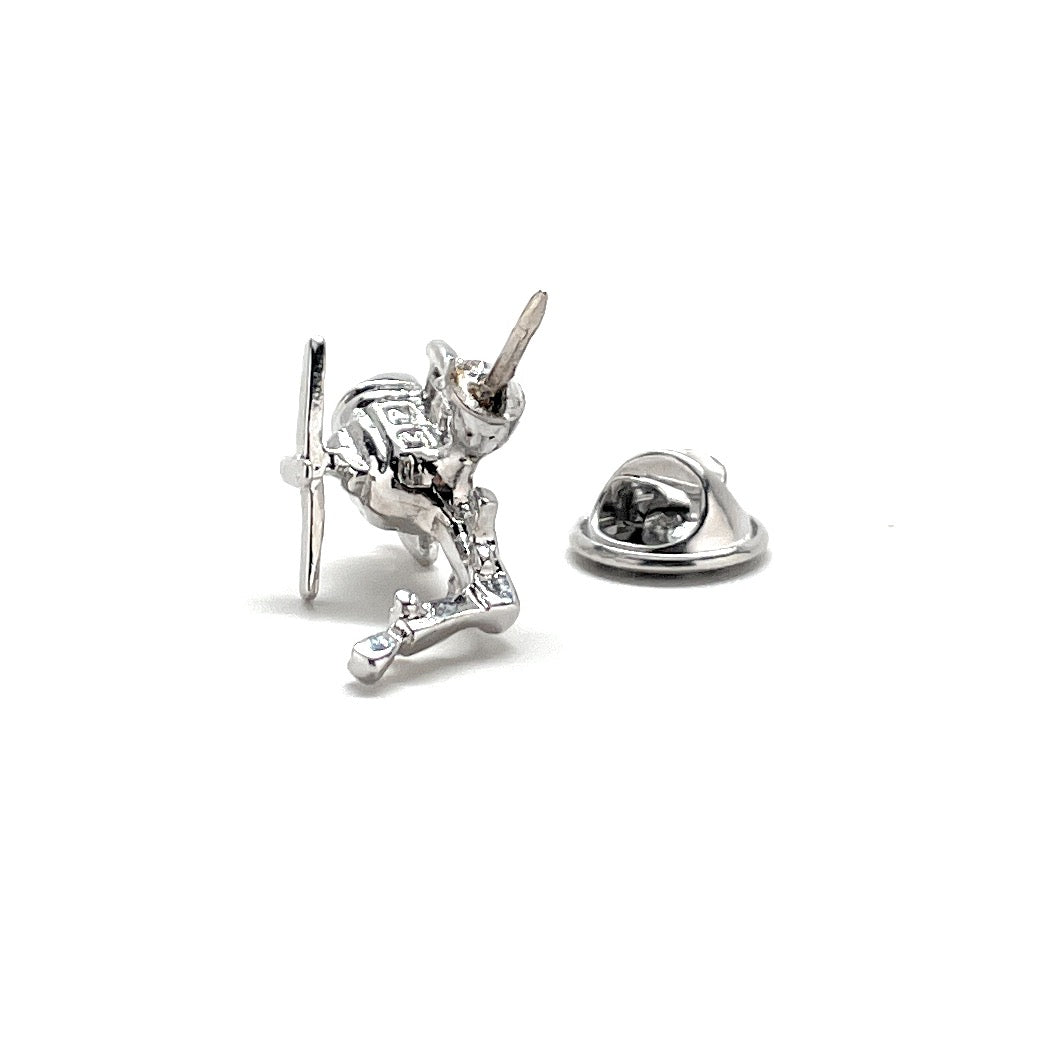 Silver knight pendant and heart-shaped charm on a white background