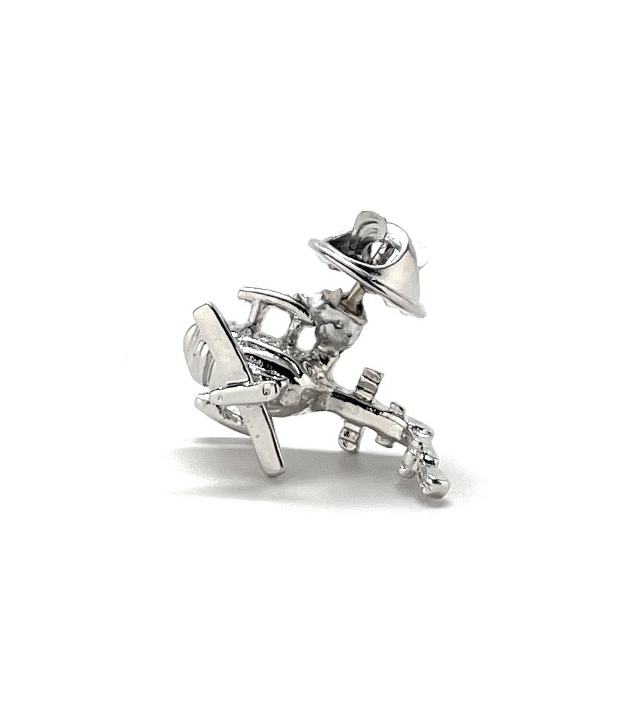 Silver airplane-shaped earrings on a white background