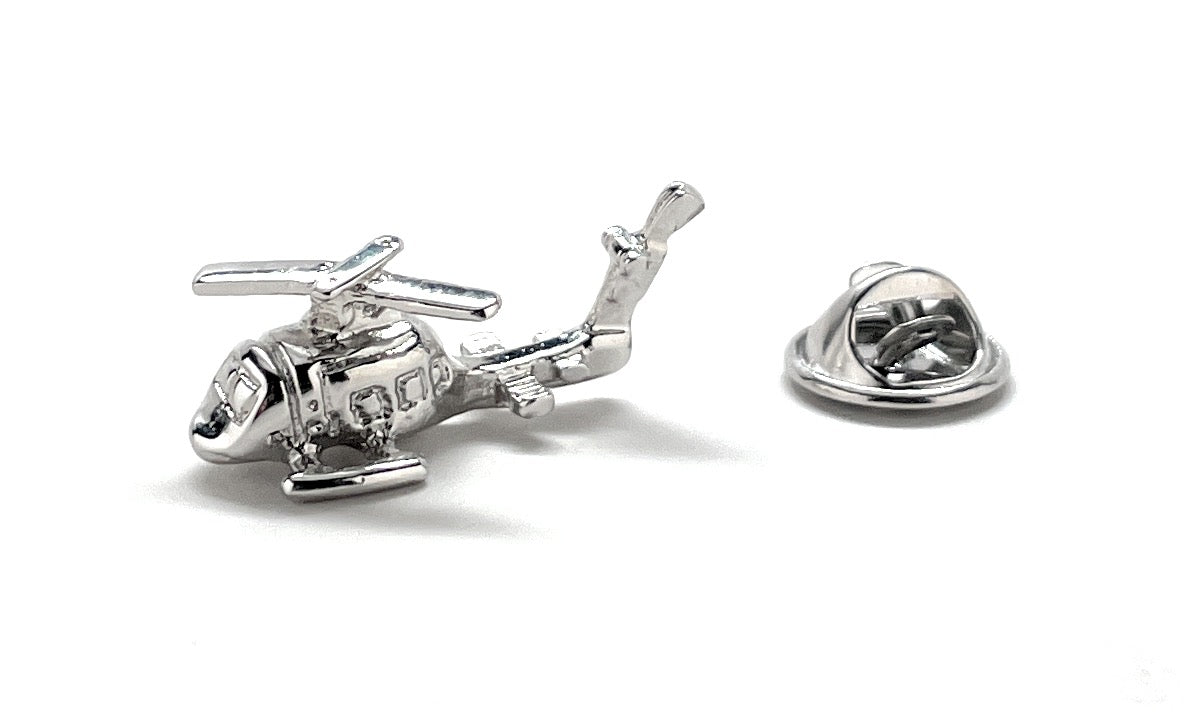 Silver helicopter cufflinks on a white background