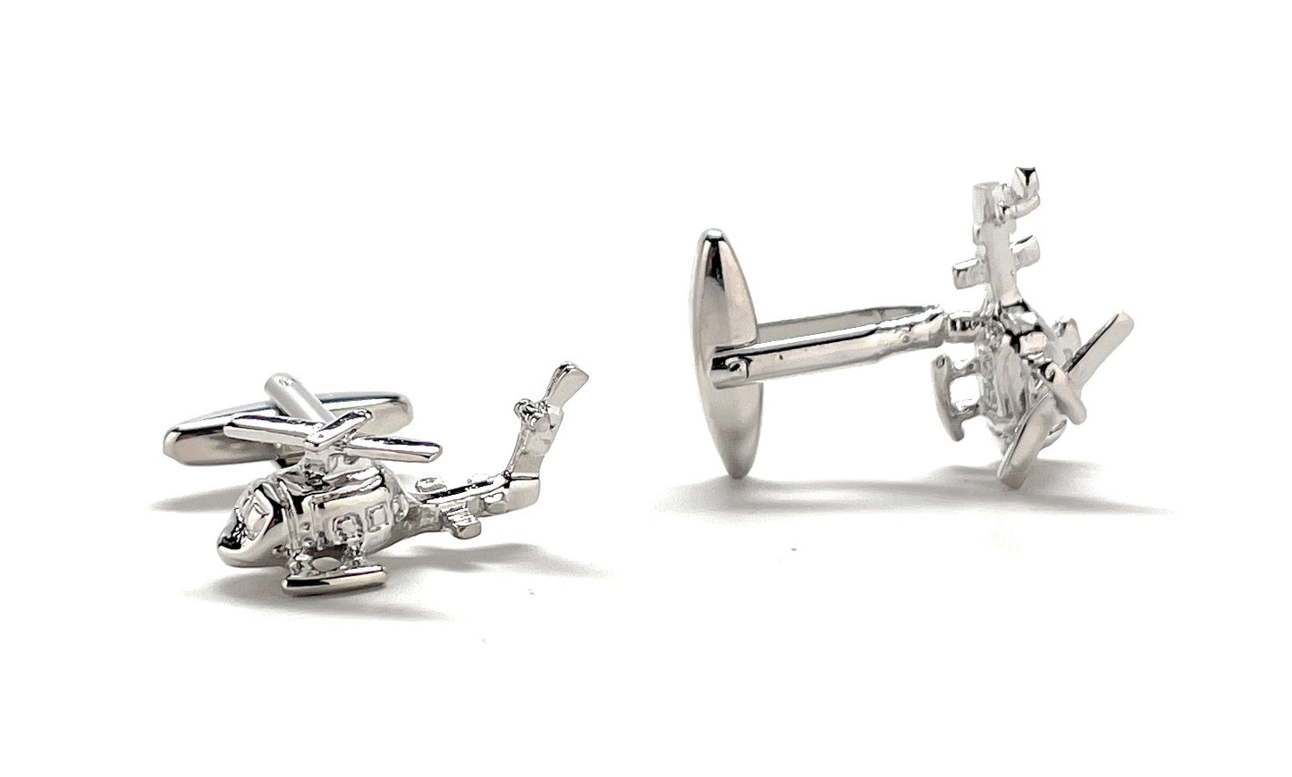 Silver helicopter cufflinks on a white background