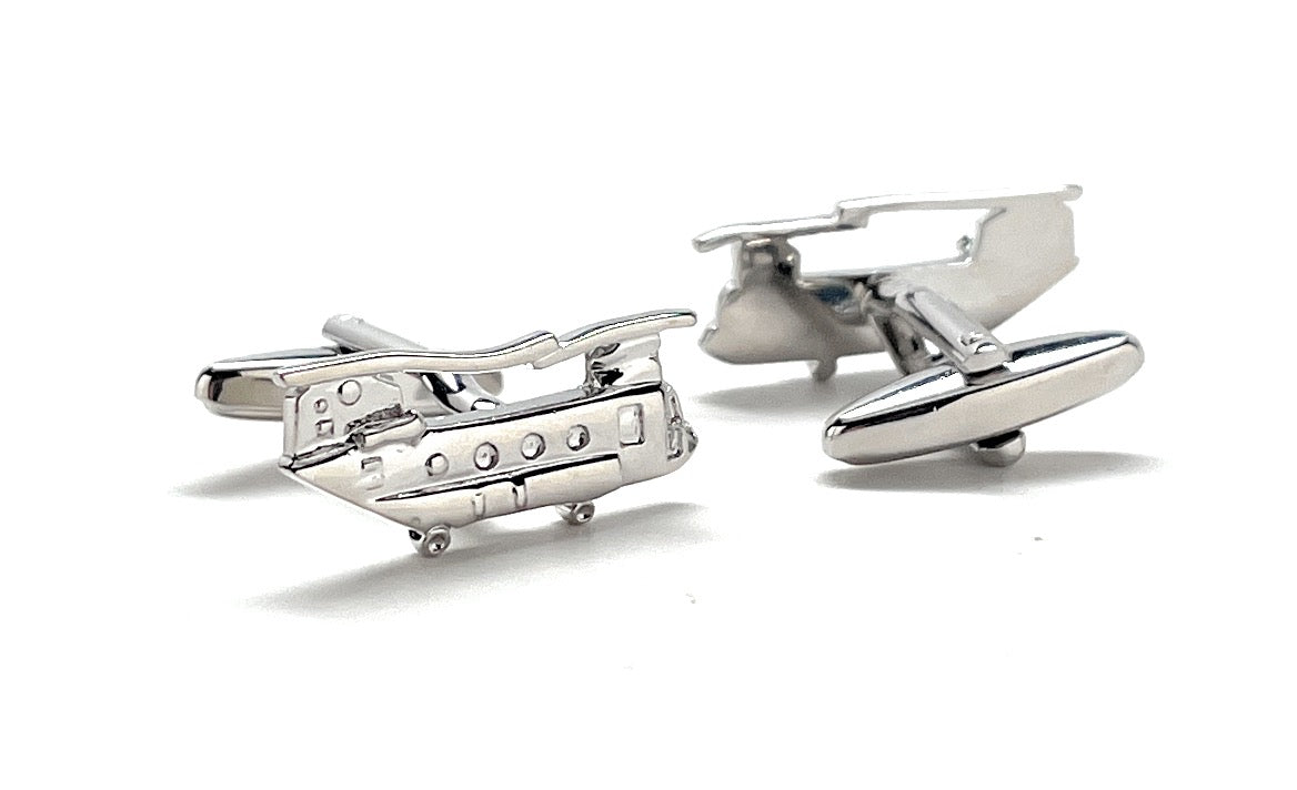 Silver helicopter cufflinks on a white background