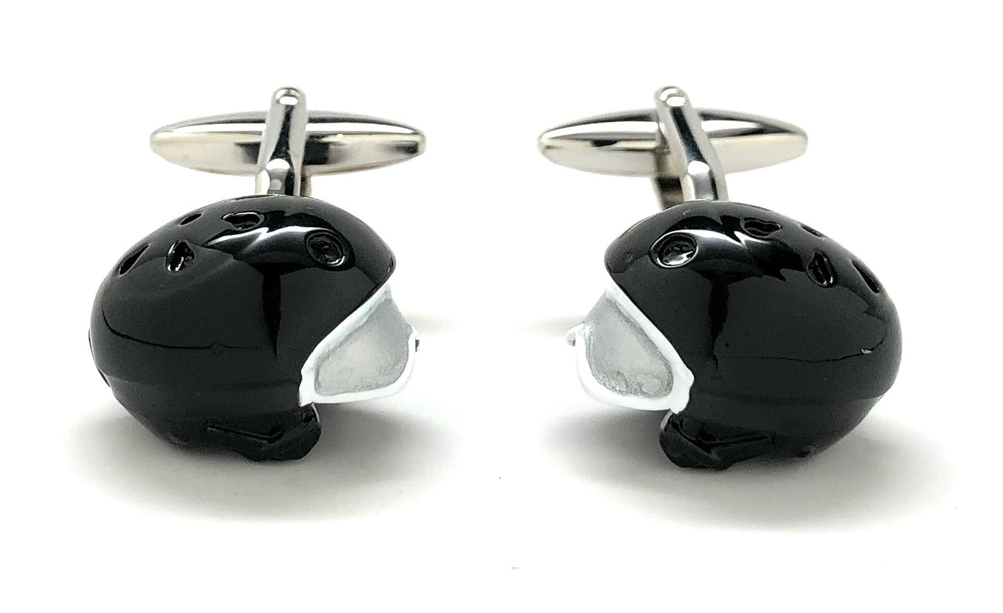 Black and silver penguin-shaped cufflinks on a white background