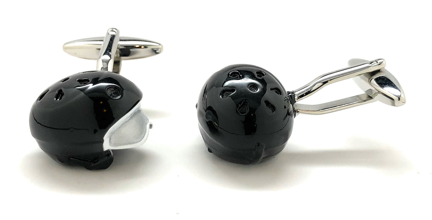 Black and silver cufflinks on a white background