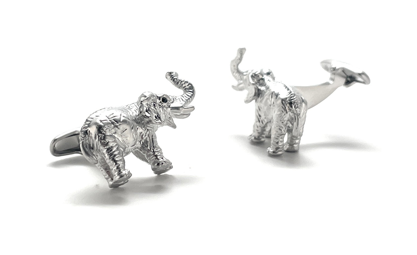 Silver elephant cufflinks on a white background