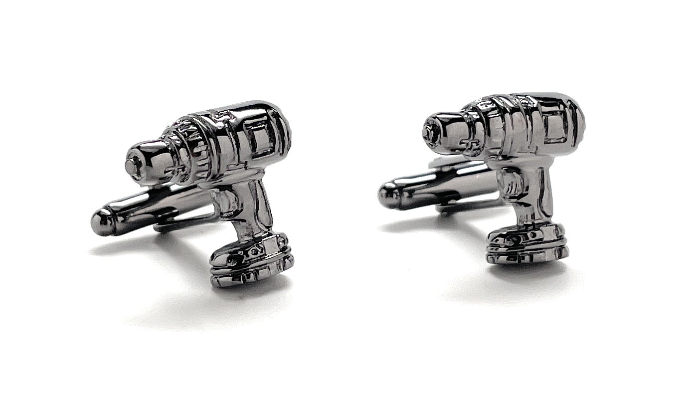 Cufflinks designed like a robot on a white background
