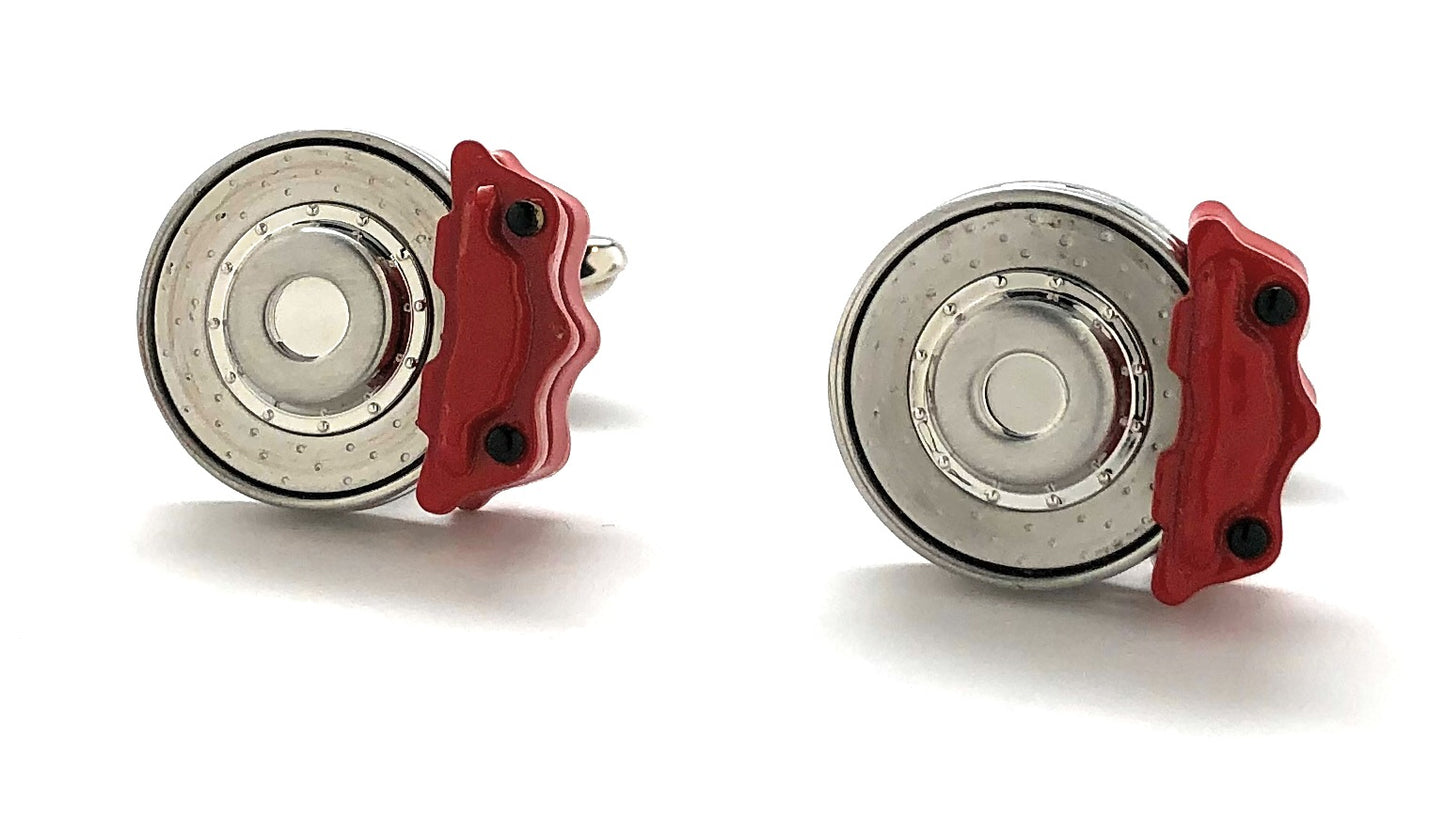 Two brake calipers with red covers on a white background