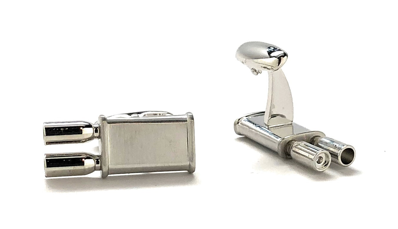 Silver cufflinks on a white background