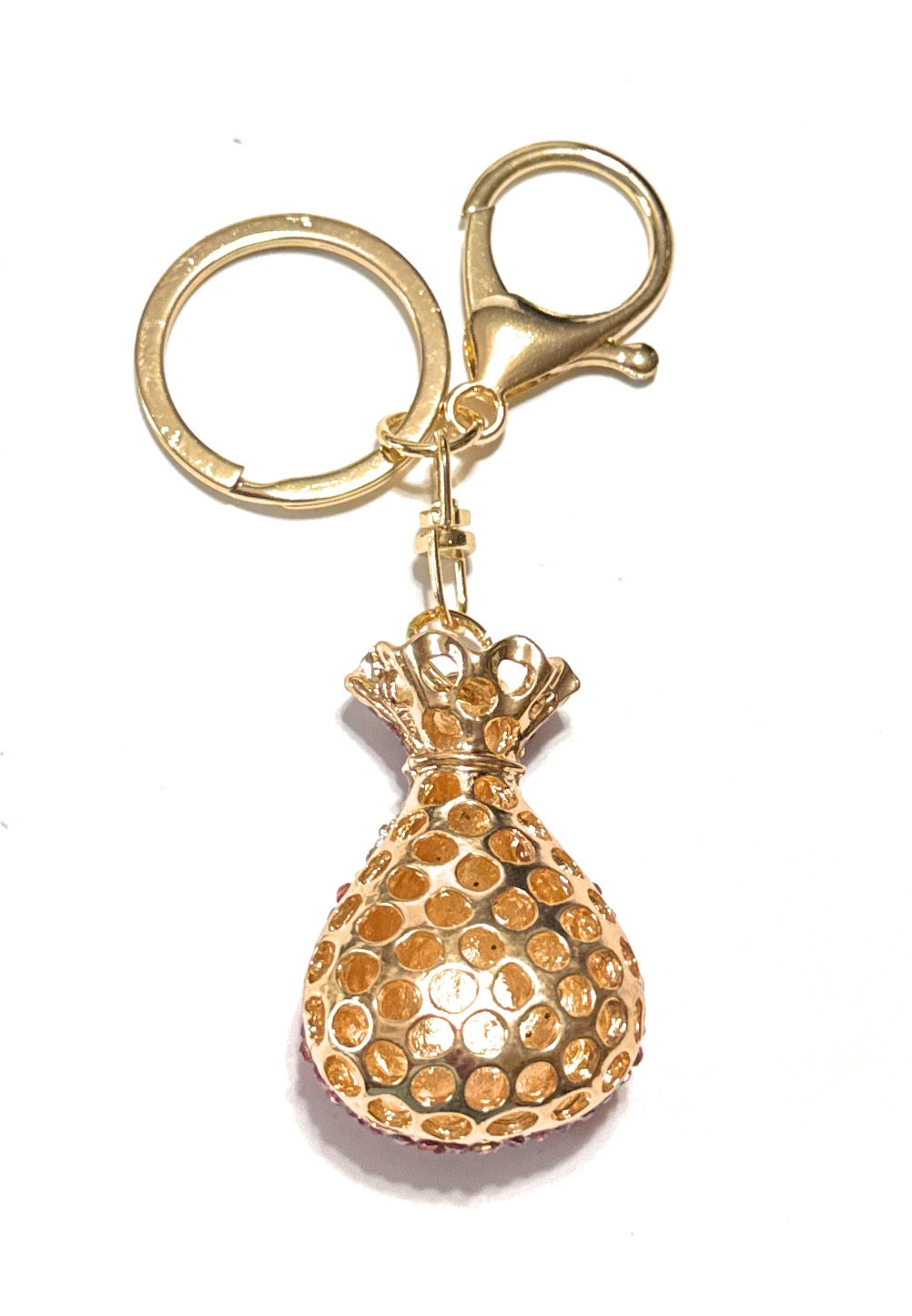 Gold pineapple keychain with a crown on a white background