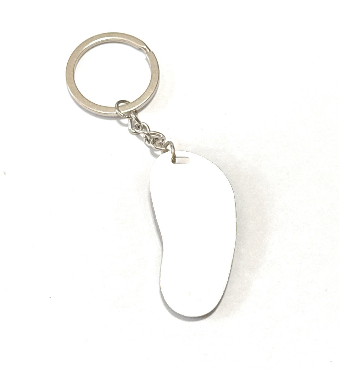 Silver keychain with a unique shaped tag on a white background