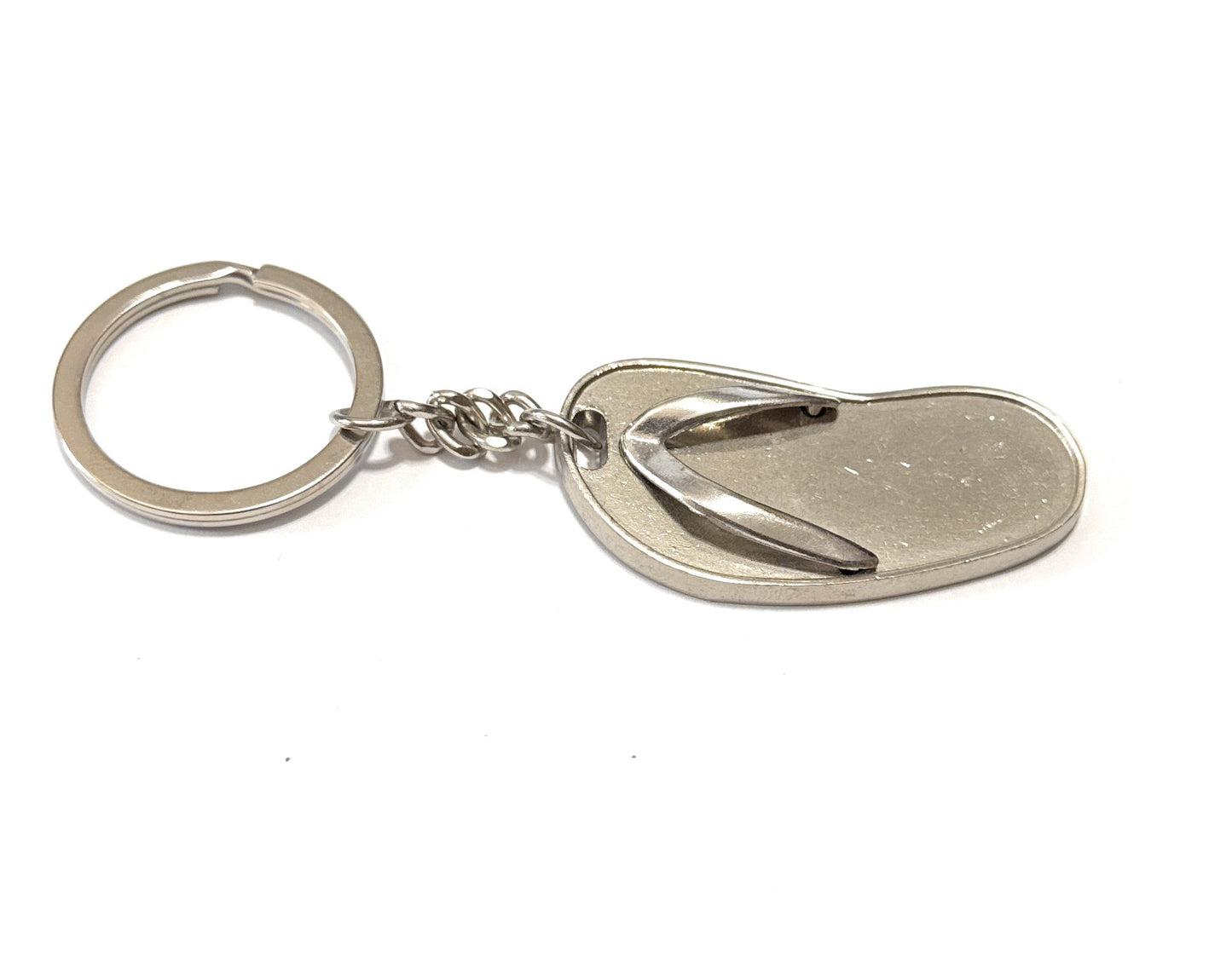 Metal keychain with a heart-shaped tag on a white background
