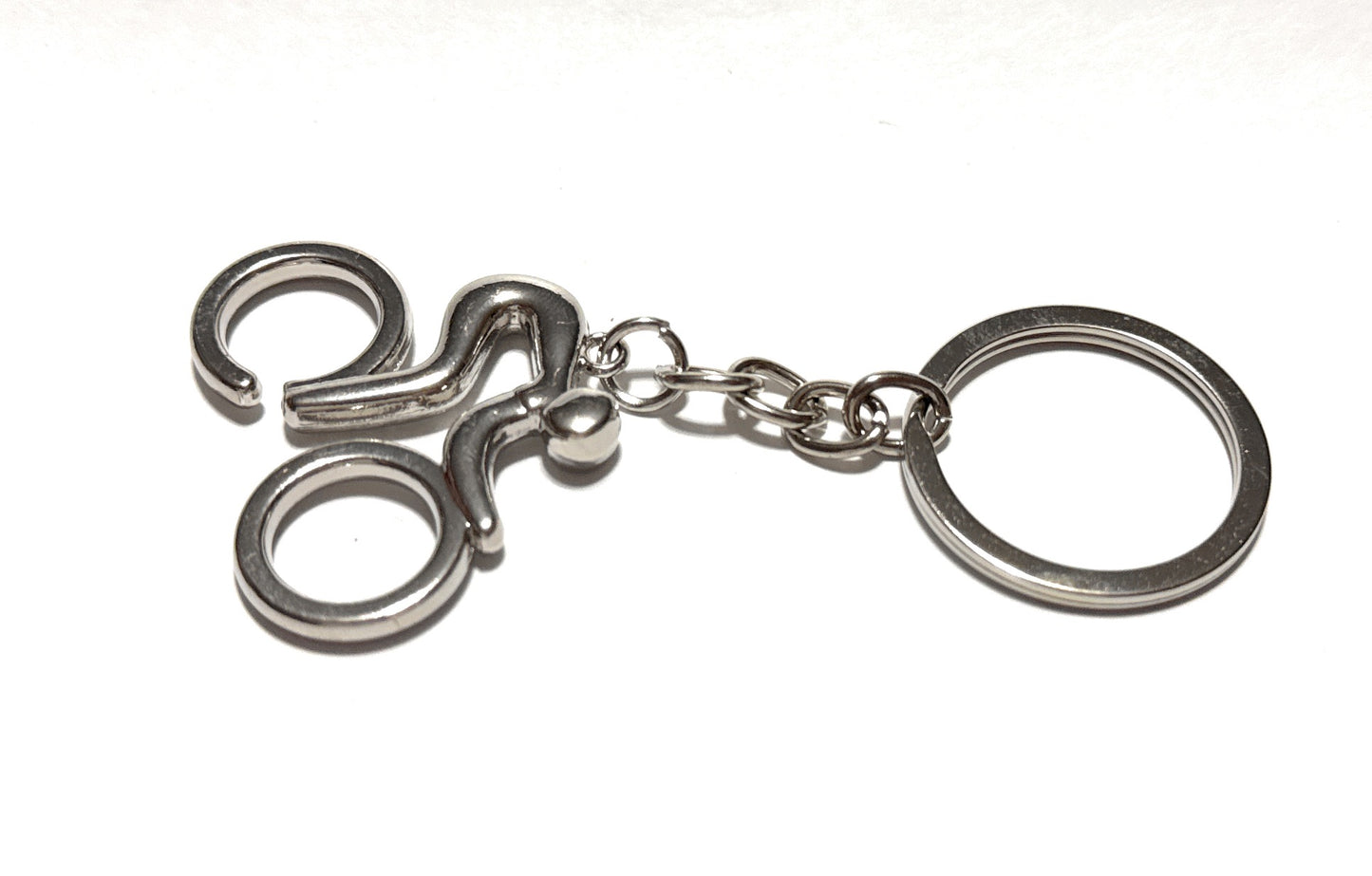 Metallic keychain with a unique design on a white background