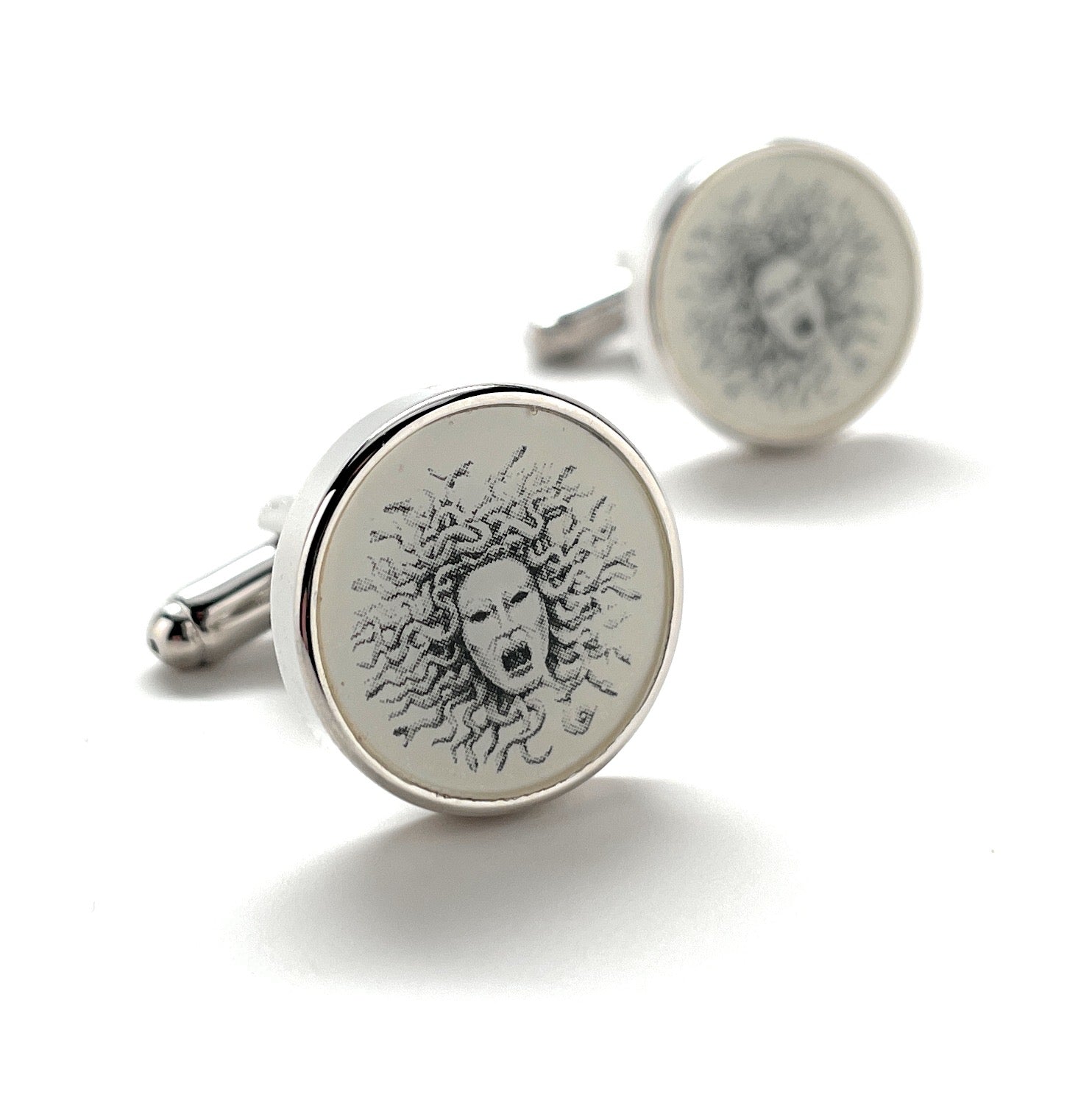 Cufflinks with a design on a white background