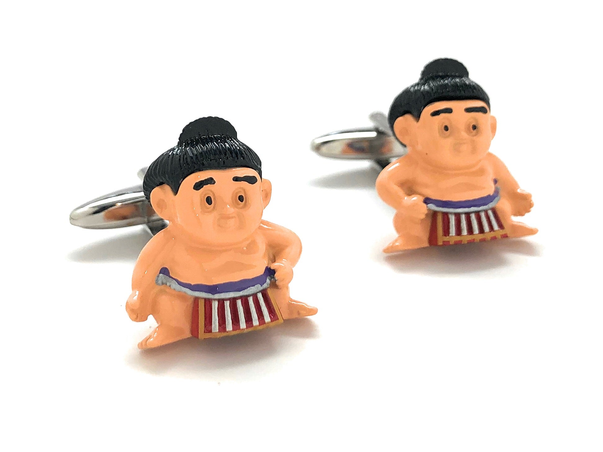 Sumo wrestler cufflinks on a white background