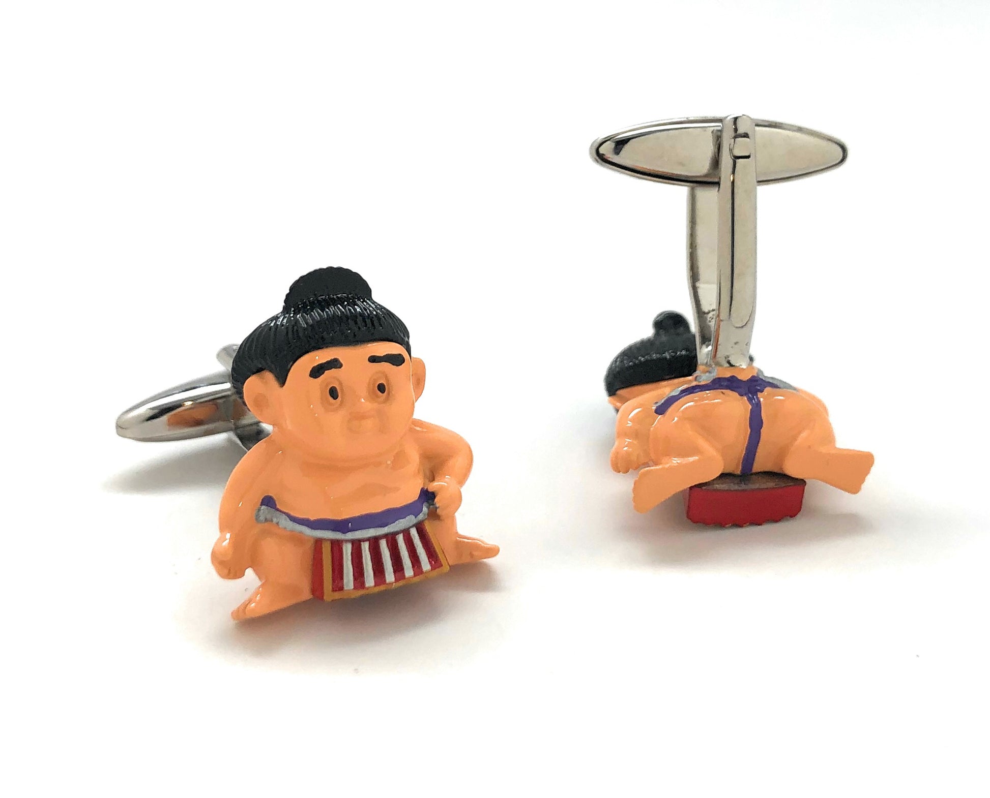 Sumo wrestler cufflinks on a white background