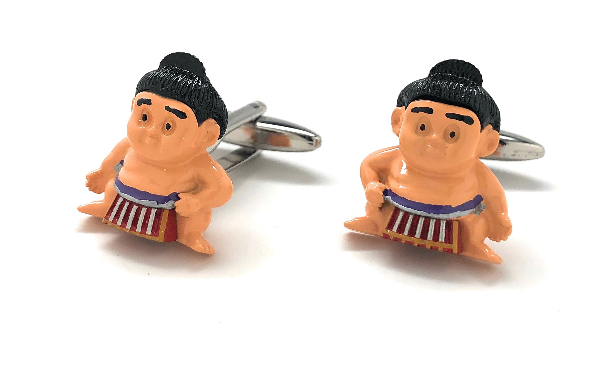Sumo wrestler cufflinks on a white background