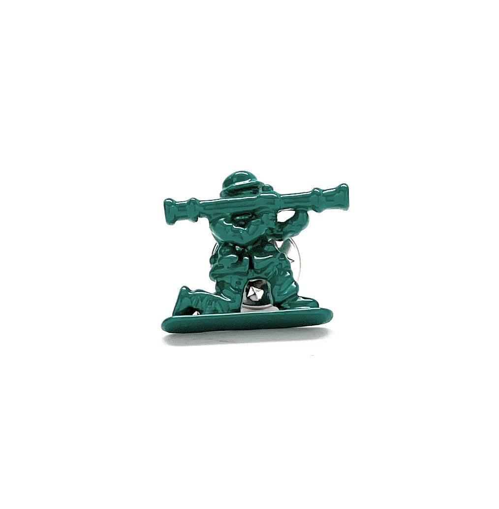 Metallic green soldier figurine with a weapon on a white background