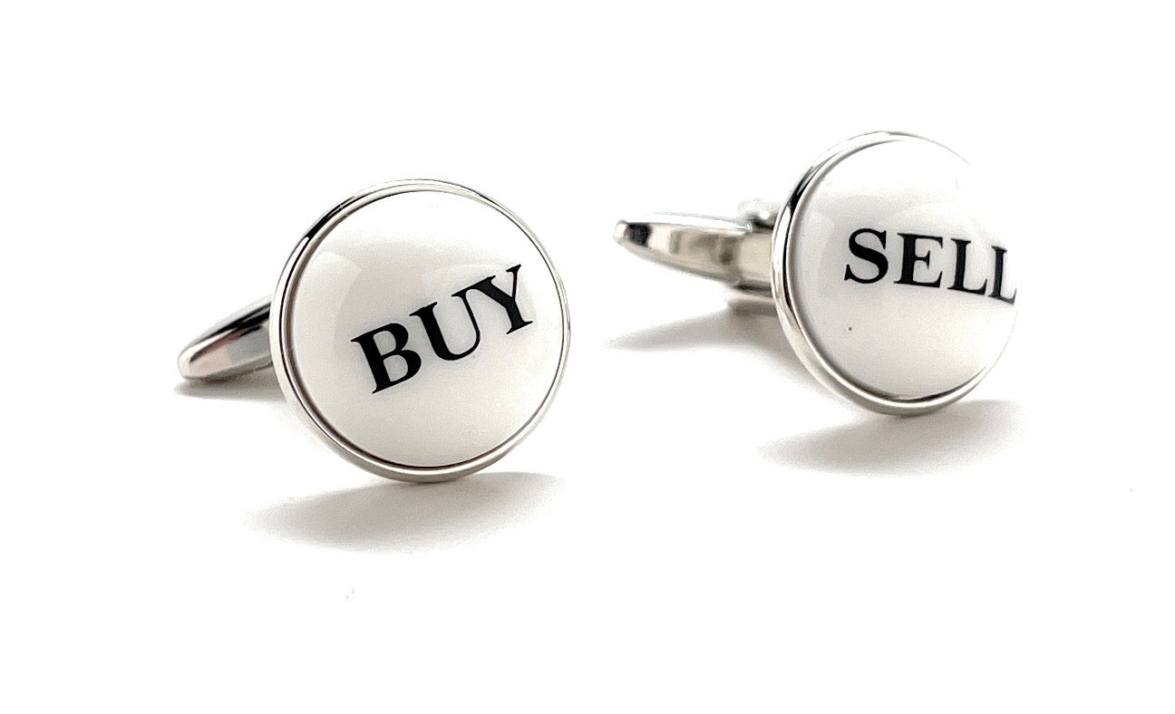 Cufflinks with 'BUY' and 'SELL' text on a white background