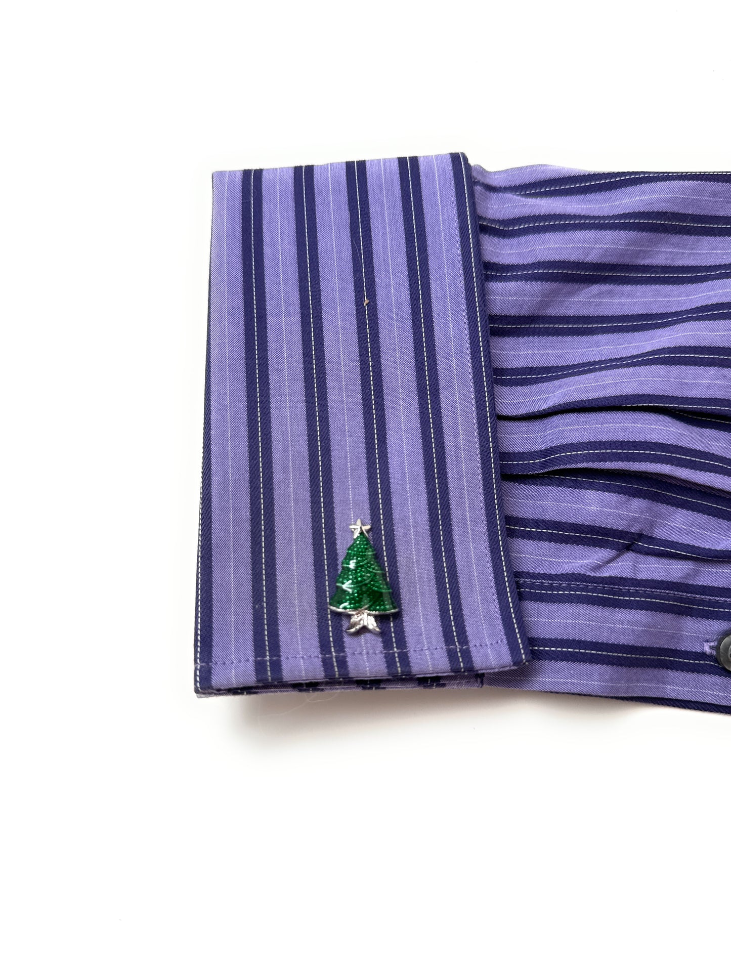 Purple striped fabric with a green embroidered design on a white background