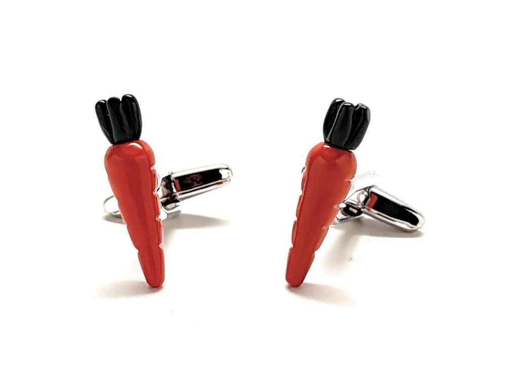 Carrot-shaped cufflinks on a white background