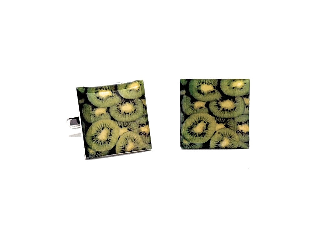 Cufflinks with kiwi fruit pattern on a white background