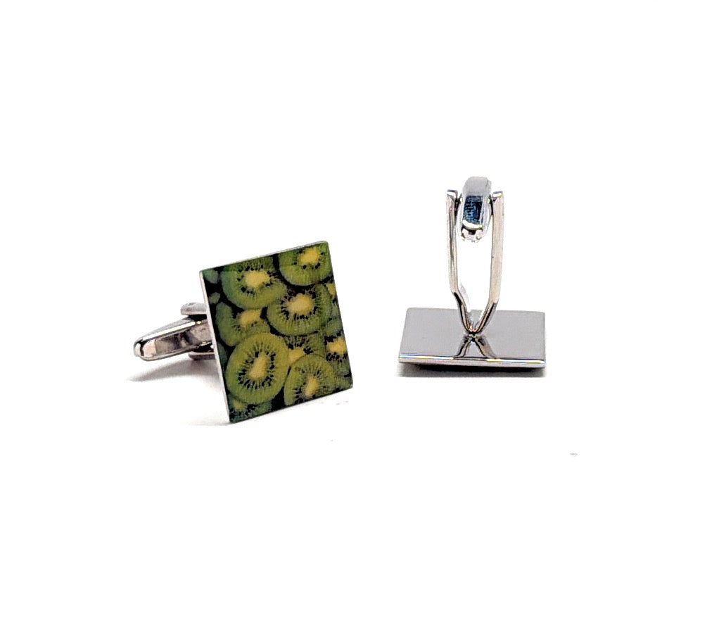 Cufflinks with a kiwi pattern on a white background