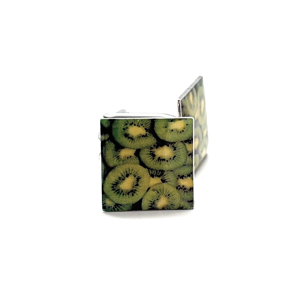 Cufflinks with a kiwi fruit pattern on a white background