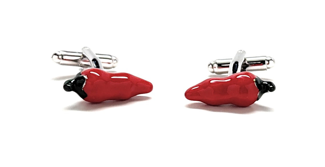 Red pepper-shaped cufflinks on a white background