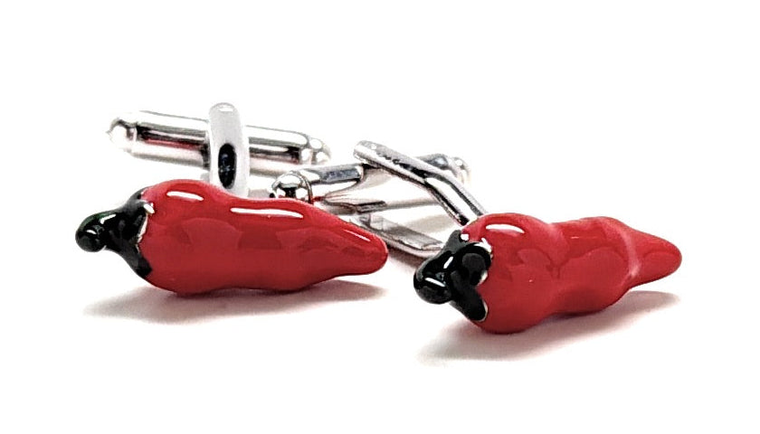Red chili pepper-shaped cufflinks on a white background