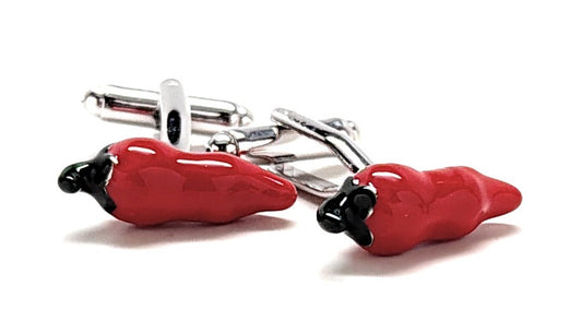 Red chili pepper-shaped cufflinks on a white background