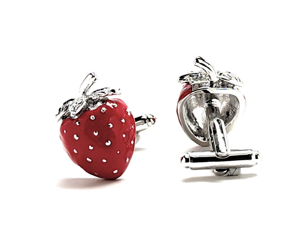 Strawberry-shaped cufflinks with silver accents on a white background