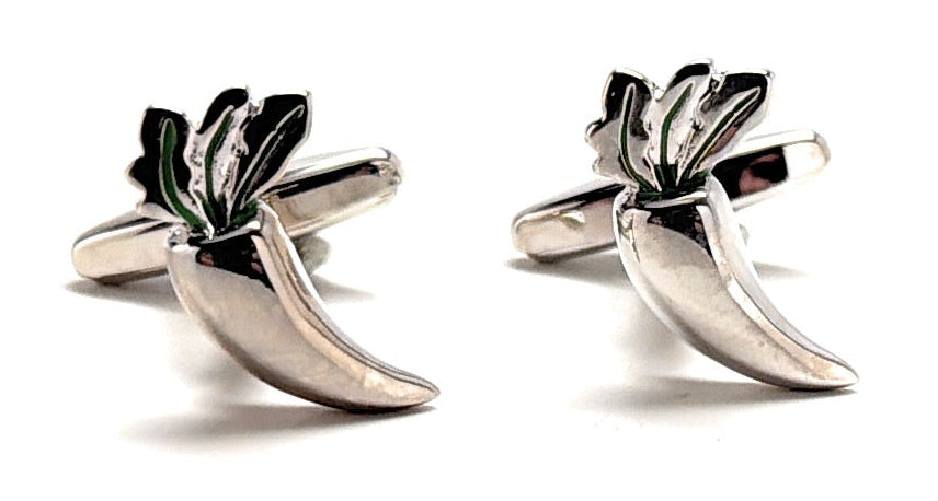 Silver cufflinks shaped like leaves on a white background
