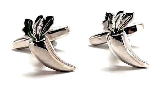 Silver cufflinks shaped like leaves on a white background
