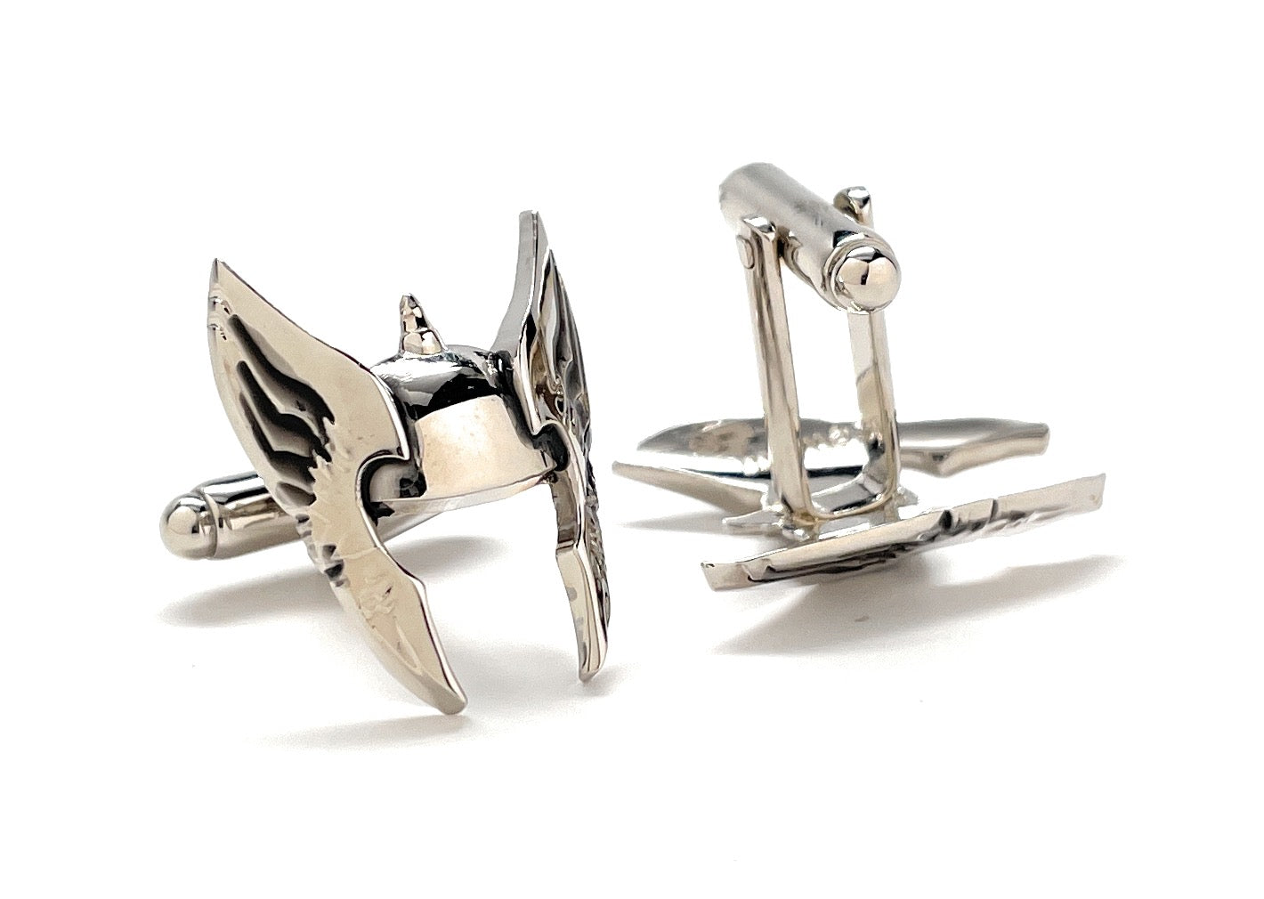 Pair of silver cufflinks on a white background