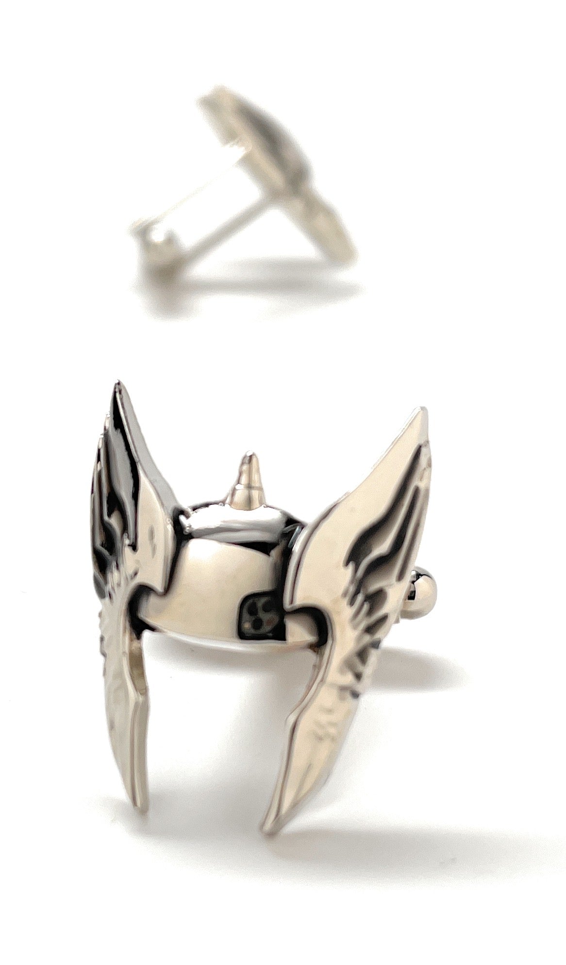 Silver bird-shaped earrings on a white background