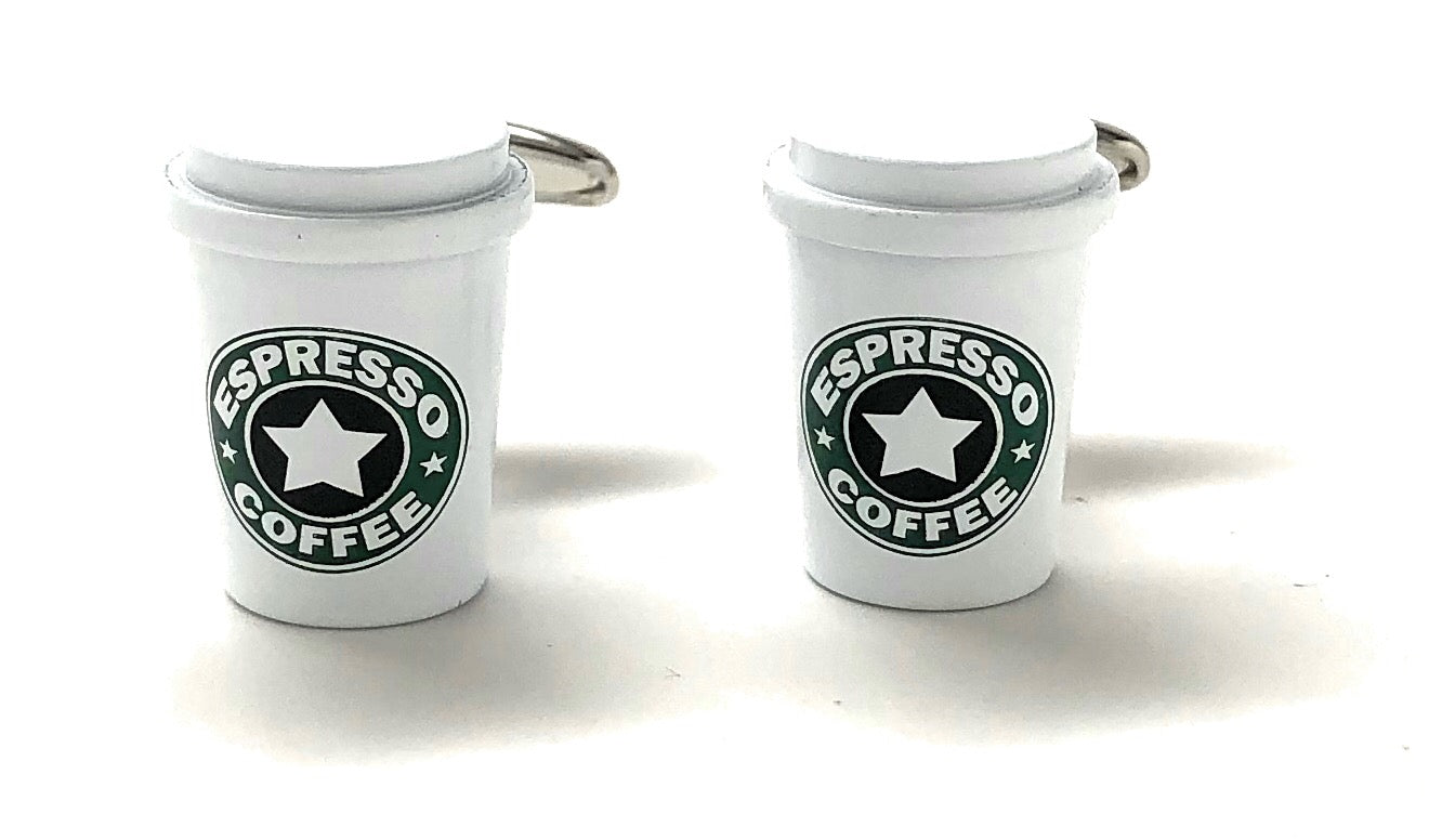 Two white keychains shaped like espresso cups with a starbucks logo on a white background