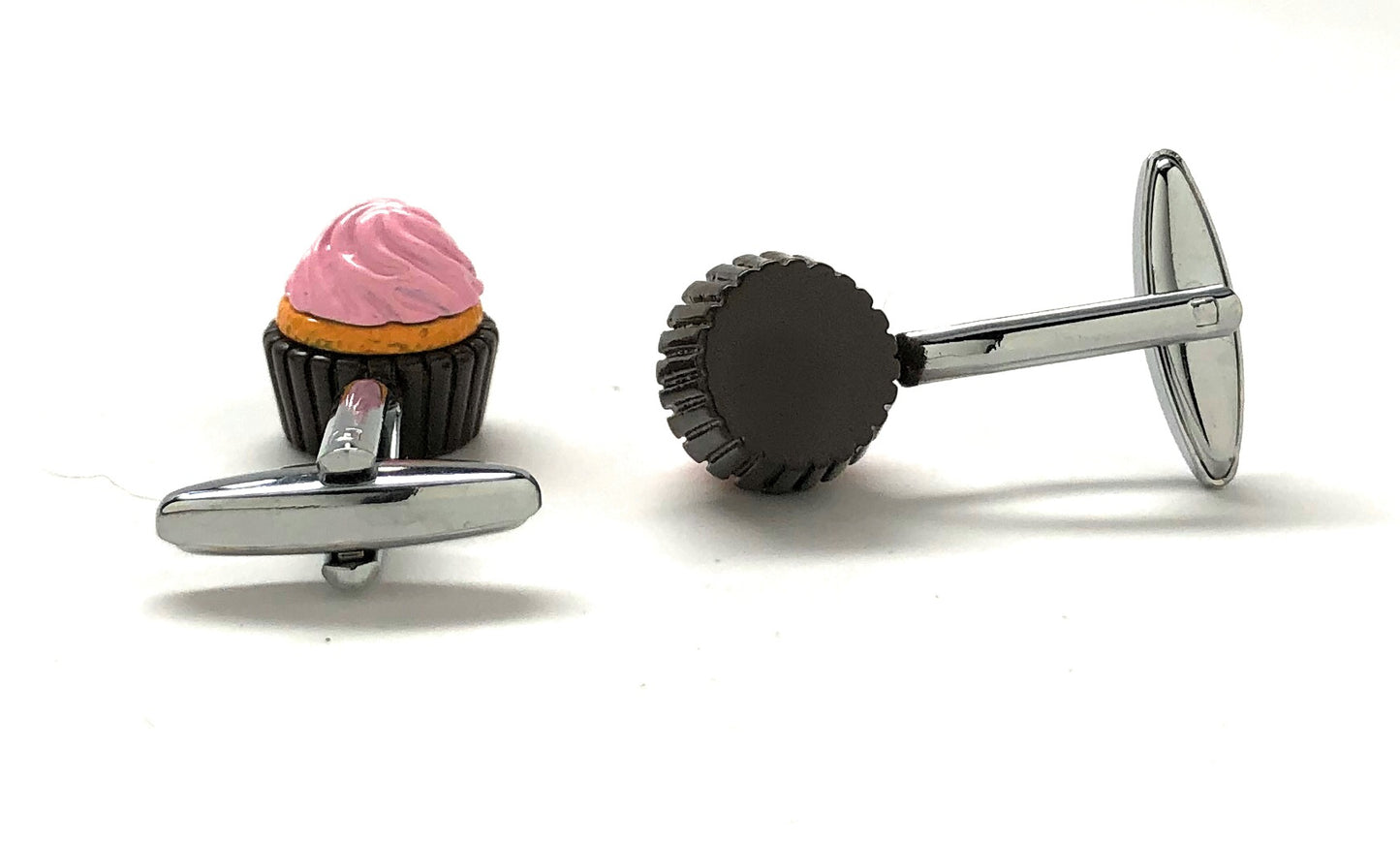 Cufflinks shaped like a cupcake with pink frosting on a white background