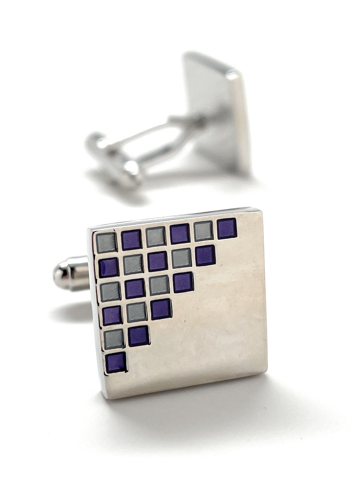 Square cufflink with grid pattern on a white background